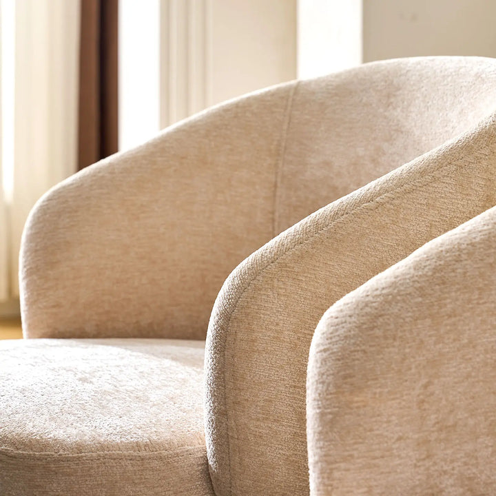 Curved armrest and soft cream chenille fabric of Cleo cream Swivel Chair