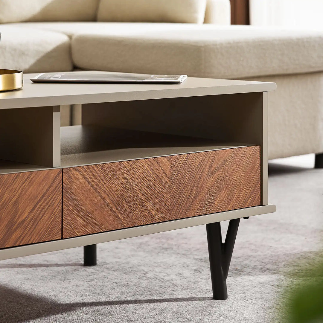 Close-up of Milano Coffee Table shelf, wood-grain panel, and black branch-shaped metal legs