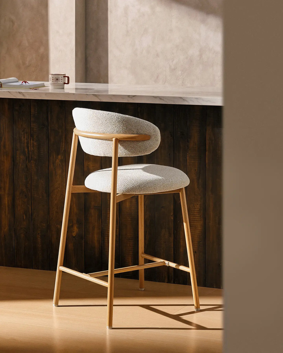 Rowan Oak Bar Stool at a kitchen island, rear side view