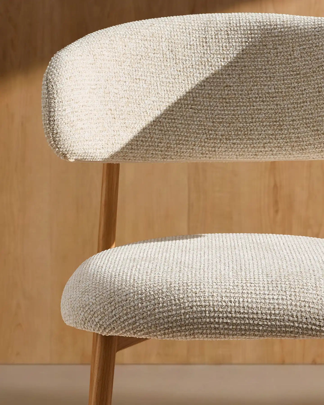 Curved backrest detail of the Rowan Oak upholstered bar stool