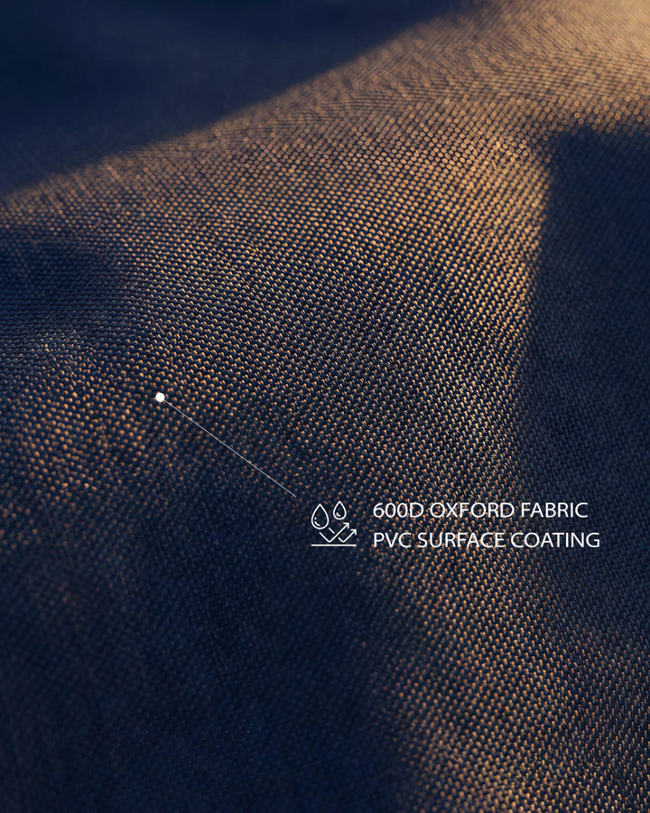 Detailed texture shot of the premium 600D Oxford fabric with waterproof PVC coating used on the 180L folding outdoor wagon.