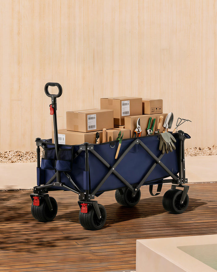 Blue 180L folding outdoor trolley wagon fully loaded with parcels and garden tools, demonstrating its high-volume carrying capability.