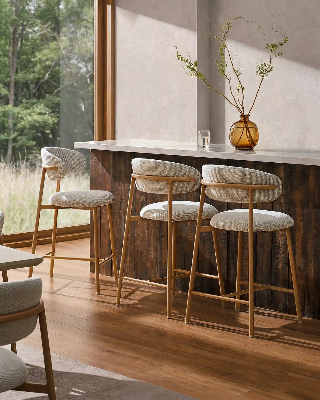 Three Rowan Oak Bar Stools around a kitchen island with oak finish