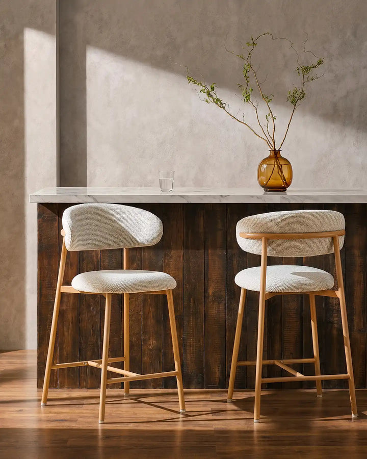 Two Rowan Oak Bar Stools at a breakfast bar in a modern kitchen