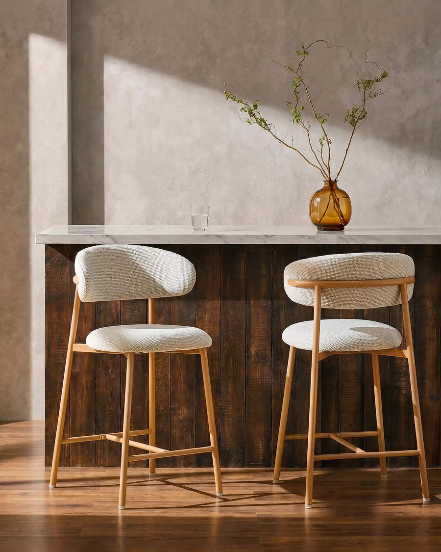 Two Rowan Oak Bar Stools at a breakfast bar in a modern kitchen