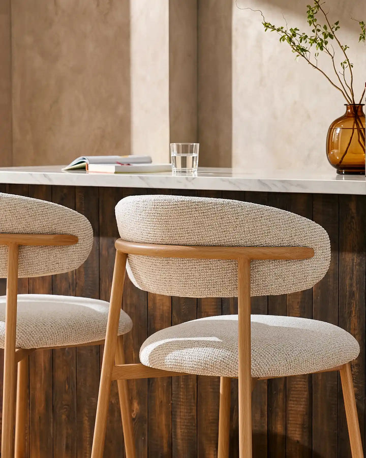 Rowan Oak Bar Stool backrest and wood-effect leg connection detail