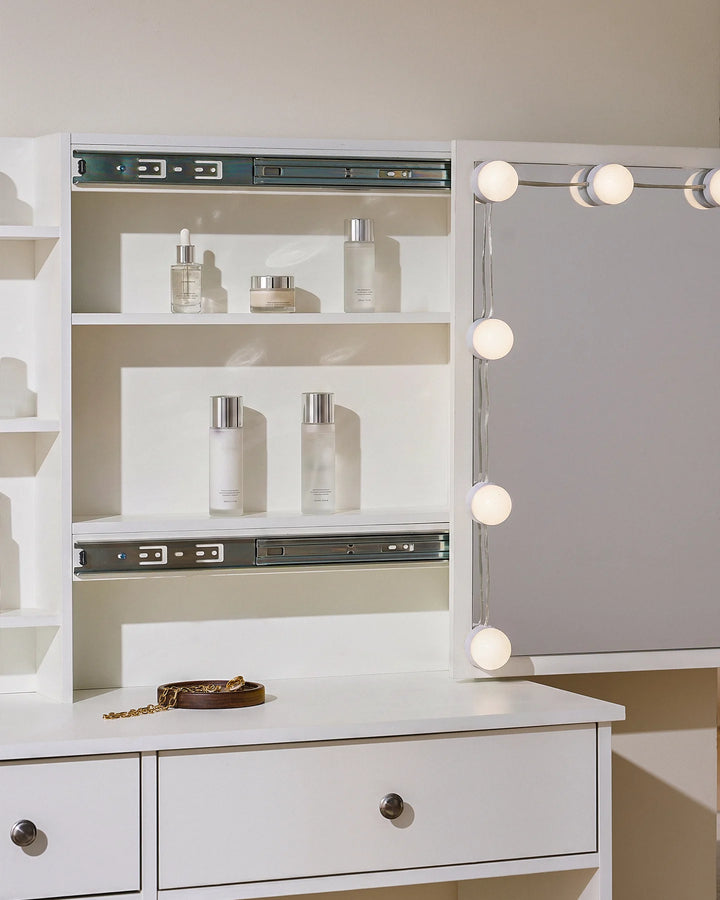 Detailed view of the dressing table, showing the compartment behind sliding mirror
