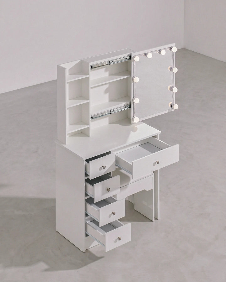 Angled view of the white Hollywood-style dressing table set with the mirror slid and drawers open, revealing hidden storage and open drawers, on a clean background.