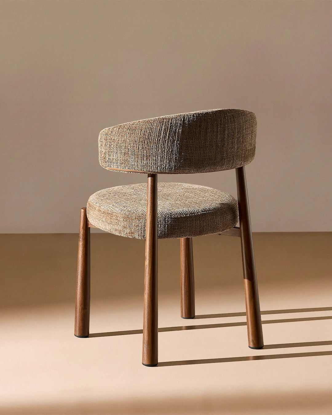 Rear view of the Ansel Mocha Chenille Dining Chair showing the curved upholstered backrest and simple, elegant frame.