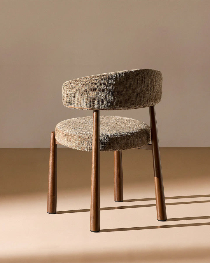 Rear view of the Ansel Mocha Chenille Dining Chair showing the curved upholstered backrest and simple, elegant frame.