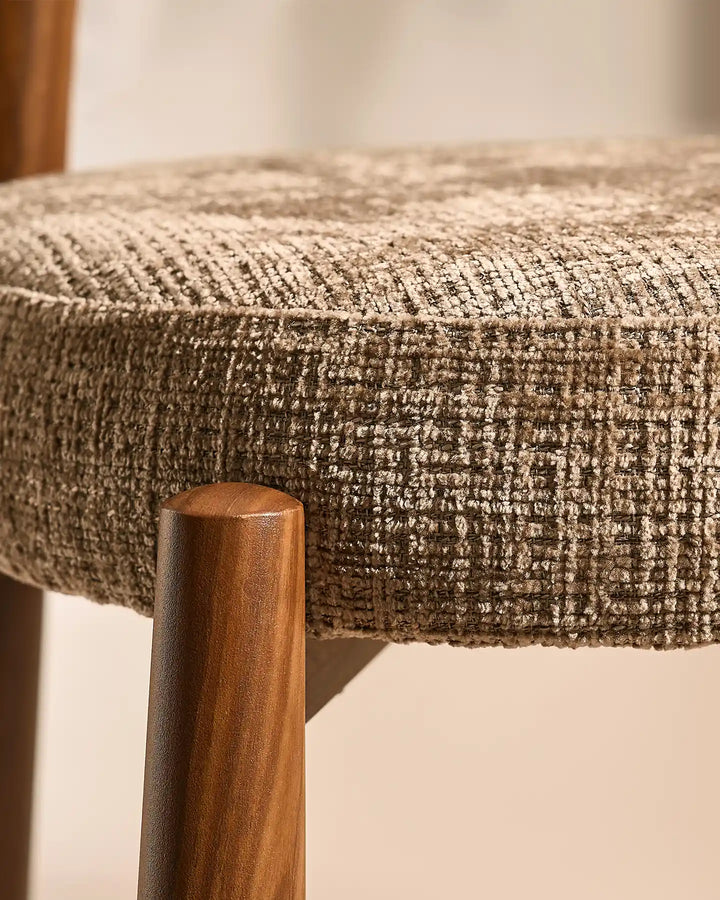 Close-up of the Ansel Mocha Chenille Dining Chair seat, highlighting the tactile woven texture and subtle tonal variations of the mocha fabric.