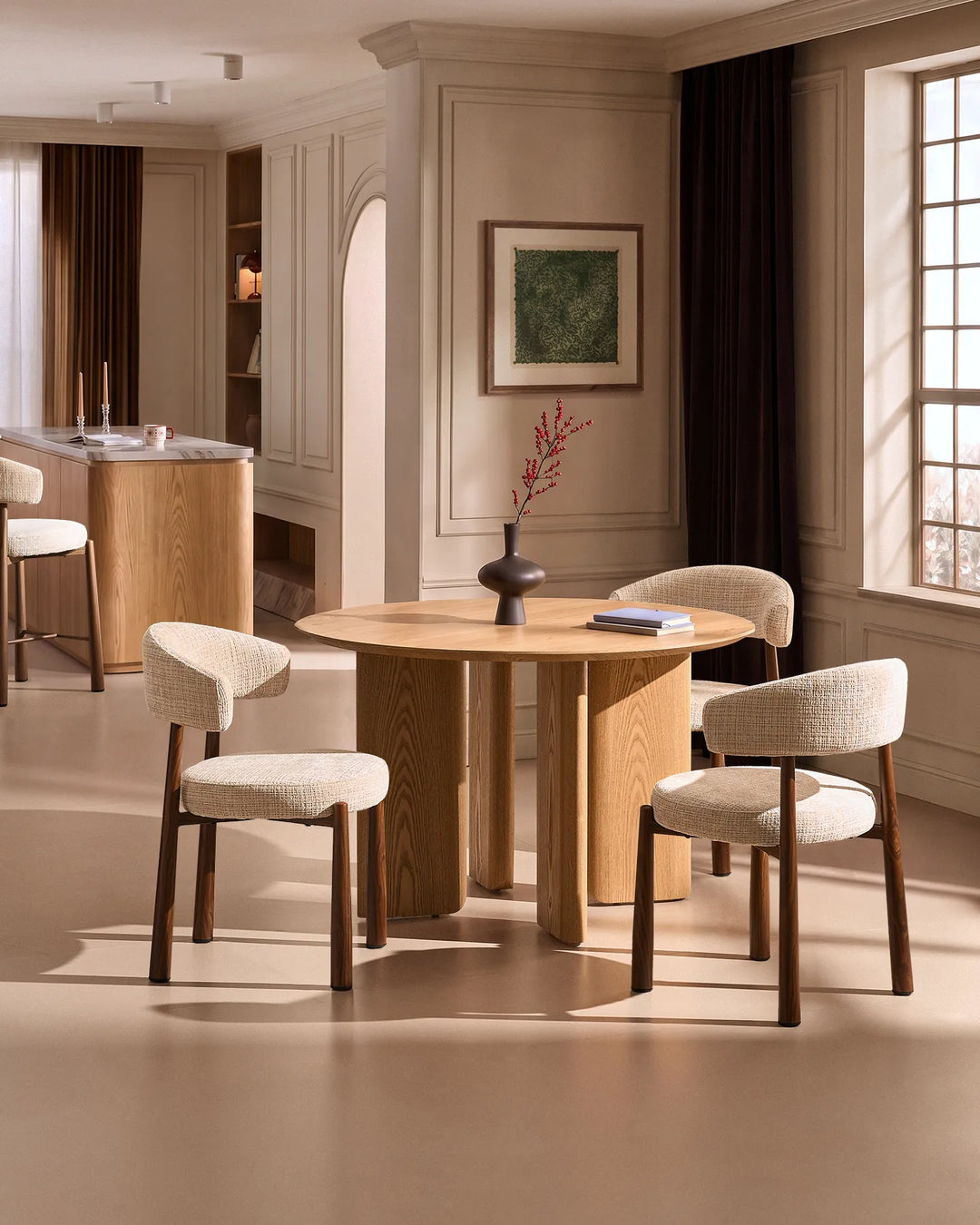 Ansel Oatmeal Chenille Dining Chairs arranged around a round wooden dining table in a warm, contemporary dining room.