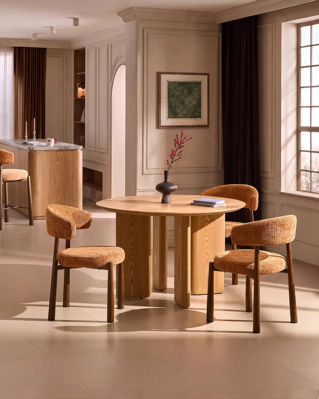 Ansel Terracotta Chenille Dining Chairs arranged around a round wooden dining table in a warm, contemporary dining room.