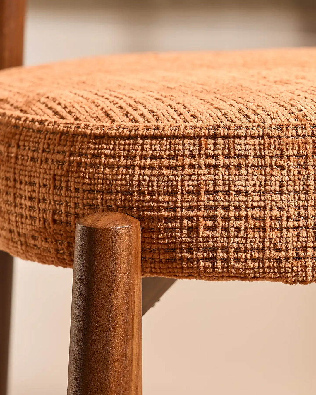 Top-down view of the Ansel Terracotta Chenille Dining Chair highlighting its rounded upholstered seat and curved backrest.