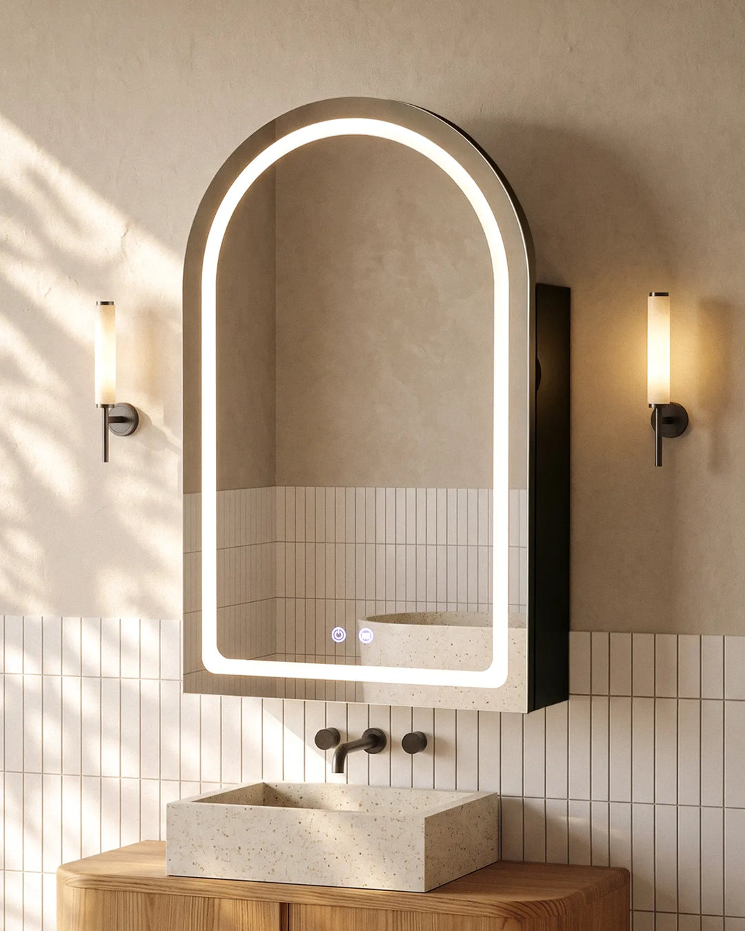 Black Arcadia arched LED mirror cabinet with warm lighting in a modern grey-tiled bathroom.