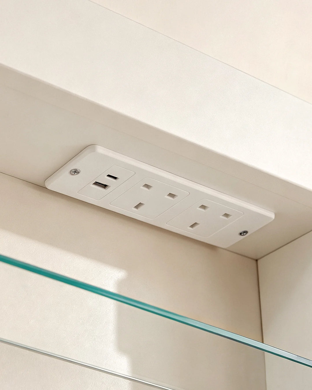Close-up of the hidden internal power hub with 2 AC outlets, 1 USB-A and 1 Type-C port in Arcadia cabinet.