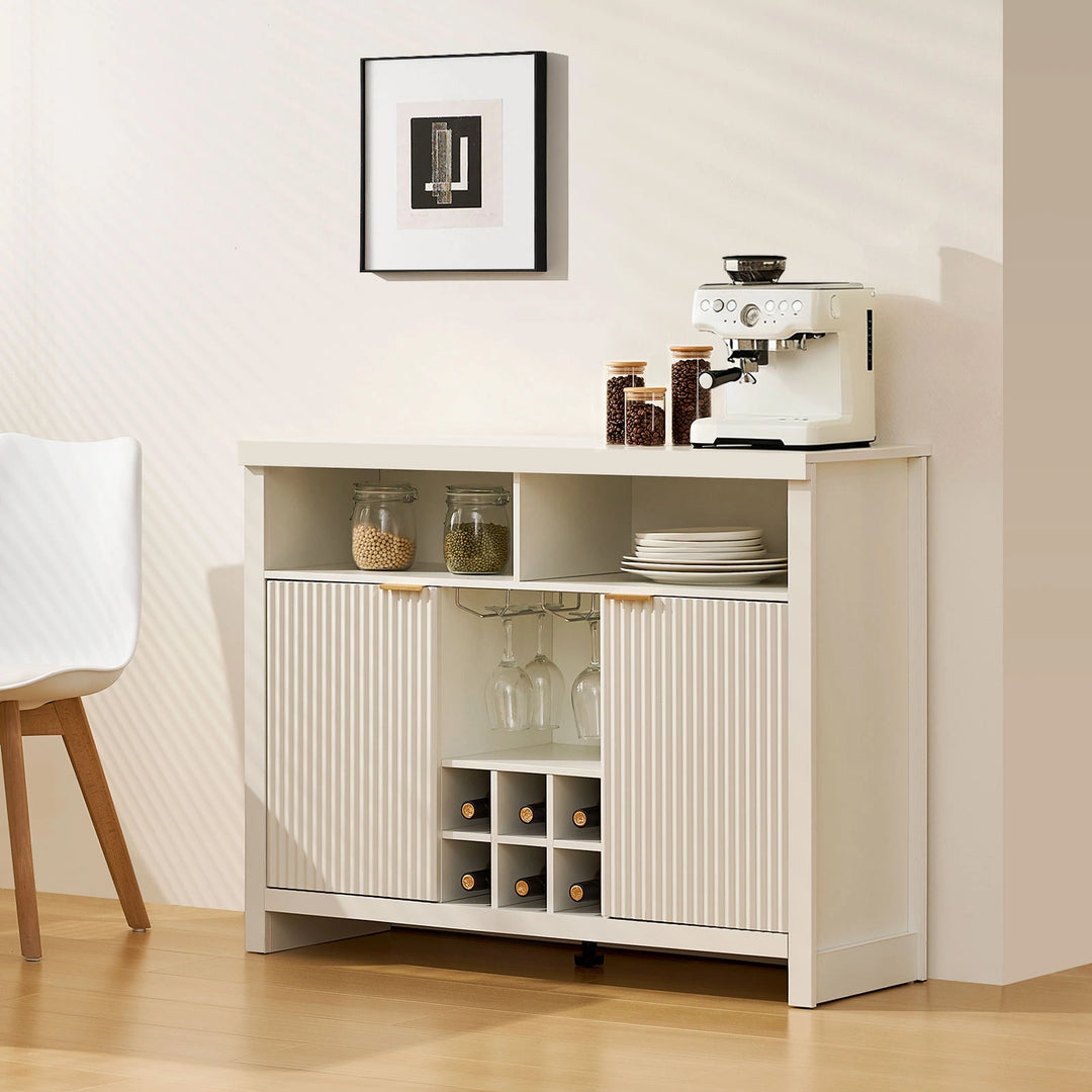 Arden Wine Bar Cabinet next to dining table with 6 bottles of wine in rack and coffee machine on top