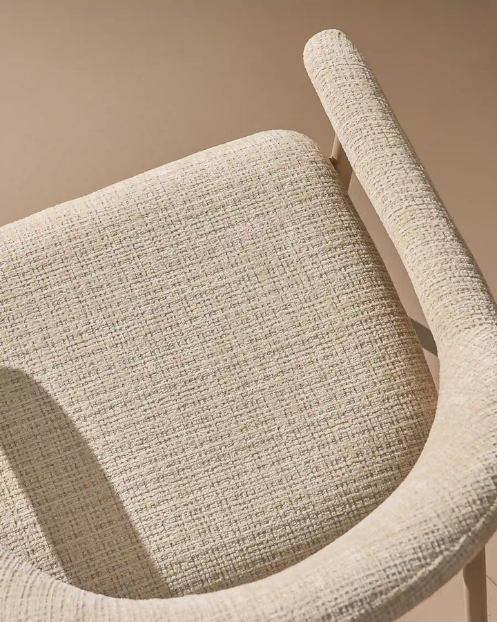 Thick padded chenille seat cushion on the Arlo Dining Chair for comfortable everyday dining