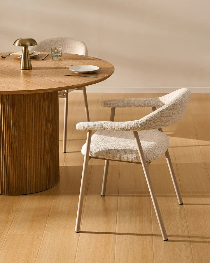 Arlo Dining Chair beside a wooden dining table in a cosy rustic dining room with soft chenille upholstery