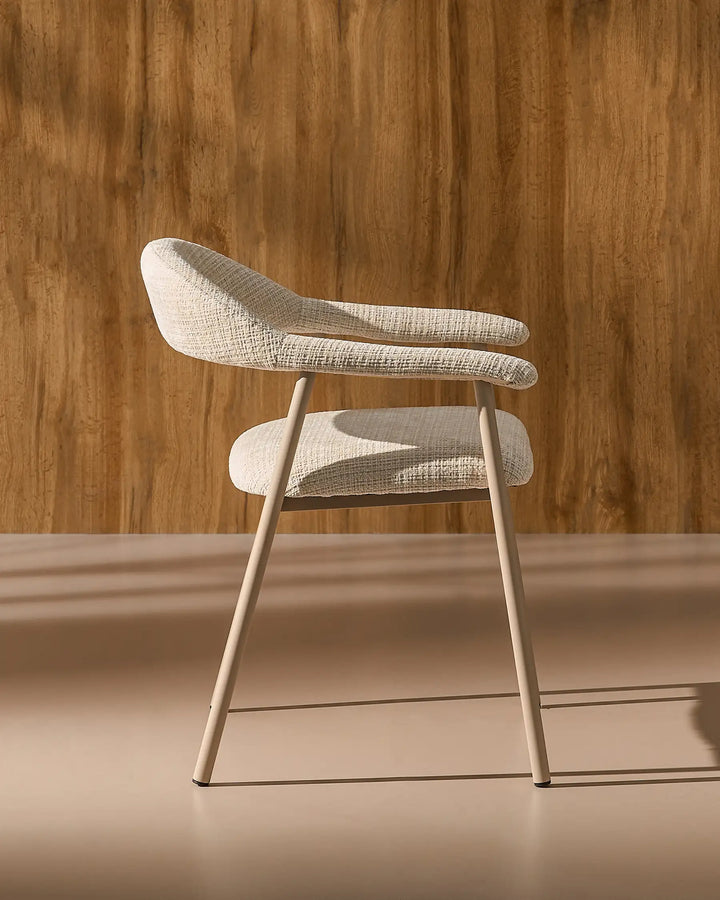 Side view of the Arlo Dining Chair showing its ergonomic profile and supportive upholstered seat