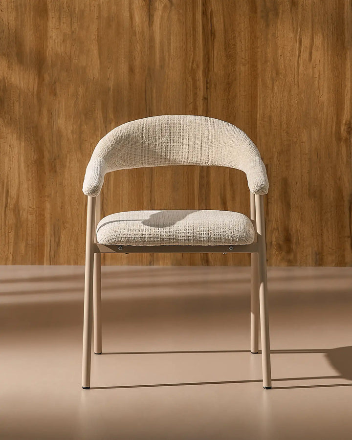 Front view of the Arlo upholstered dining chair with chenille fabric, curved armrests and metal legs