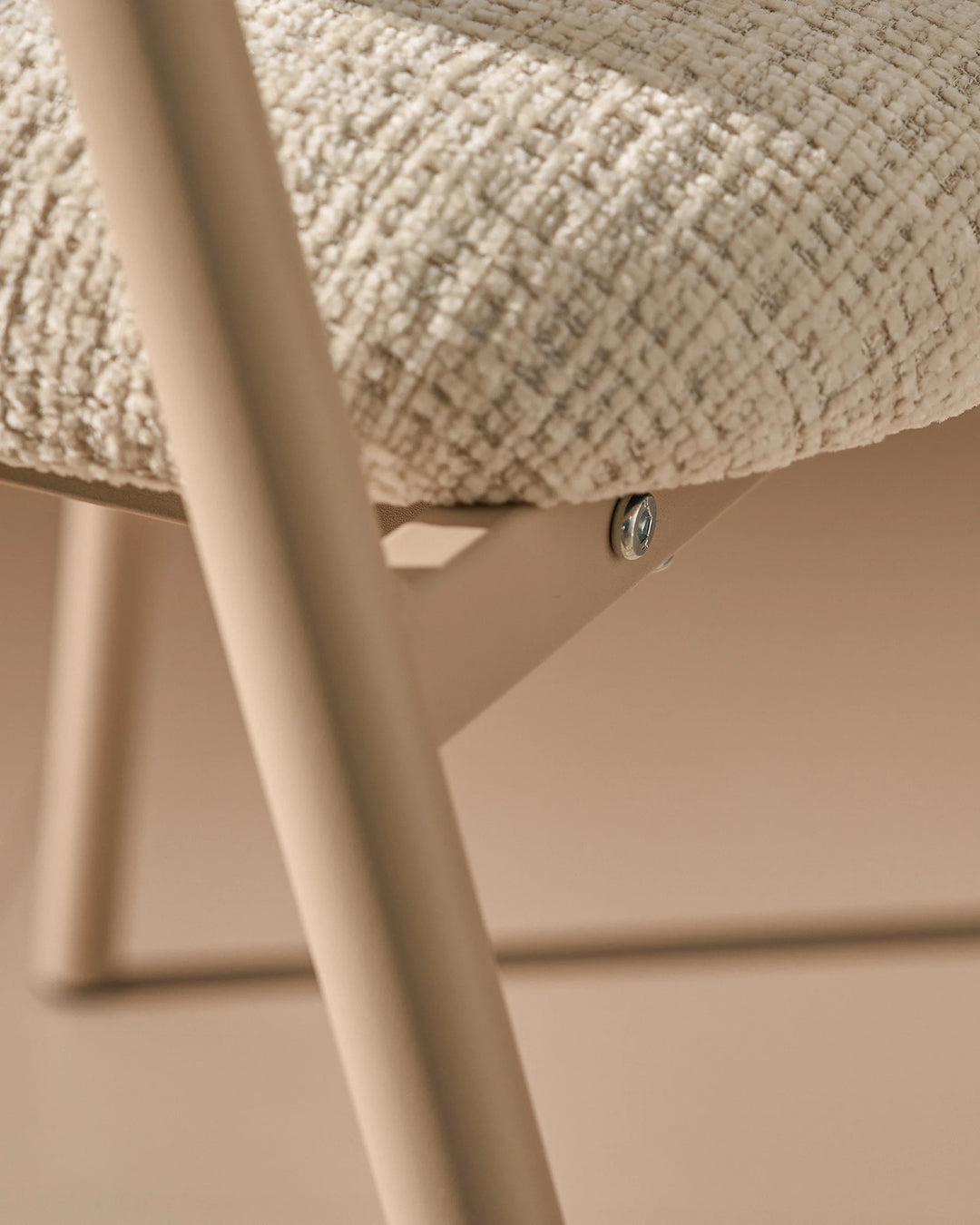 Powder-coated metal legs of the Arlo Dining Chair with a durable modern finish