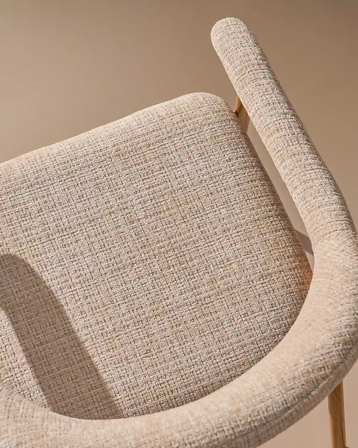 Thick padded chenille seat cushion on the Arlo Dining Chair for comfortable everyday dining