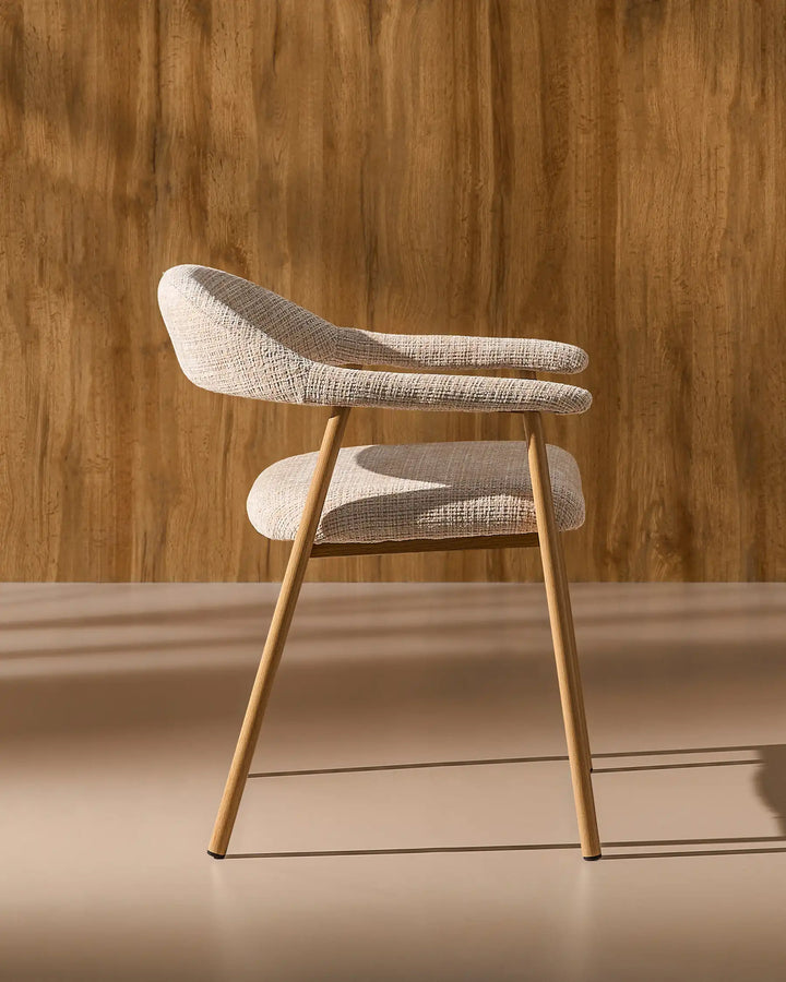 Side view of the Arlo Dining Chair showing its ergonomic profile and supportive upholstered seat