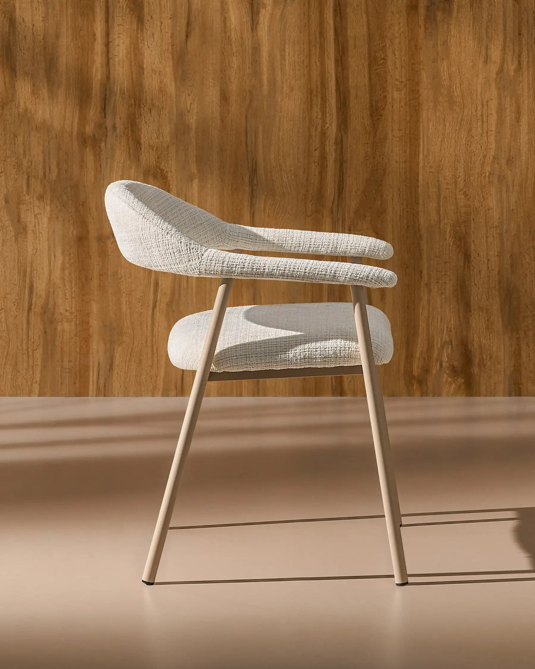 Side view of the Arlo Dining Chair showing its ergonomic profile and supportive upholstered seat