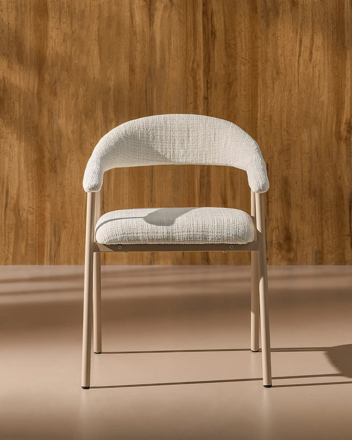 Front view of the Arlo upholstered dining chair with chenille fabric, curved armrests and metal legs