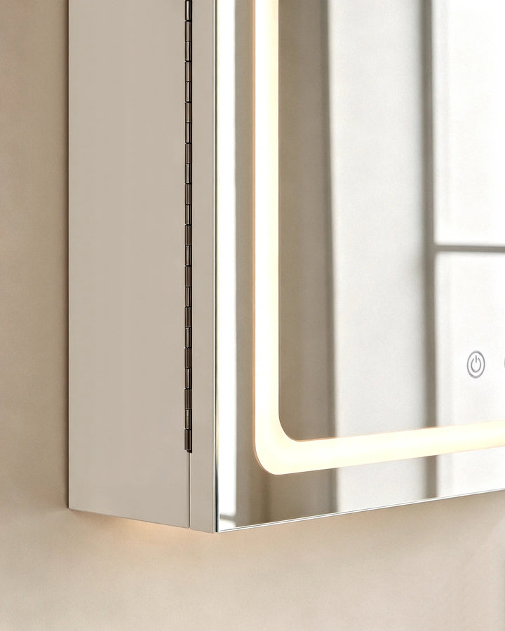 Close-up of the bottom edge and LED strip of the Arcadia arched mirror cabinet.