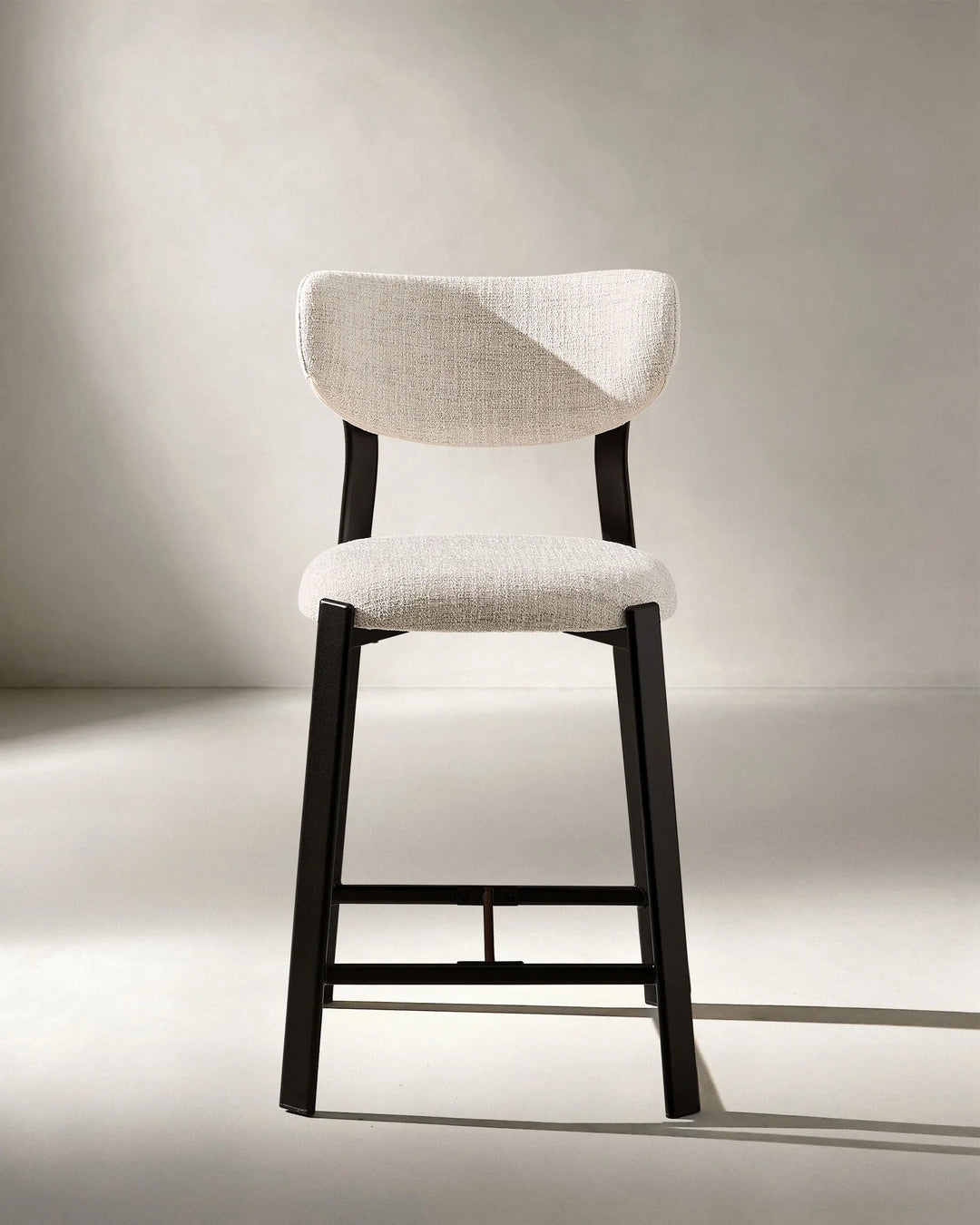 Front view of Bramley Black Oak Bar Stool featuring linen fabric upholstery and modern farmhouse styling