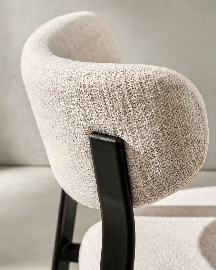 Curved back detail of Bramley Black Oak Bar Stool showing textured linen fabric upholstery
