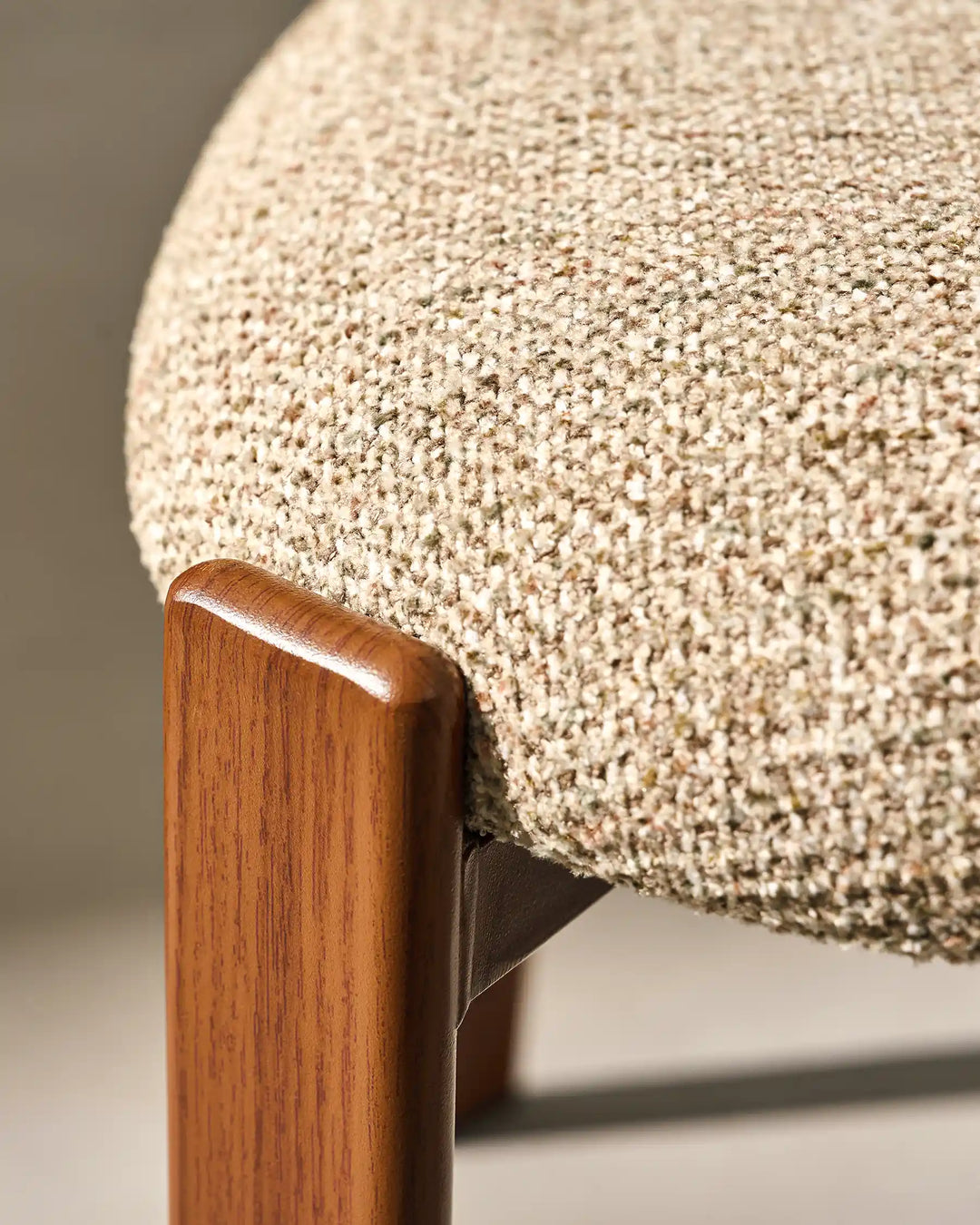 Top view detail of Bramley Rustic Chenille Dining Chair showing seat and wooden leg connection