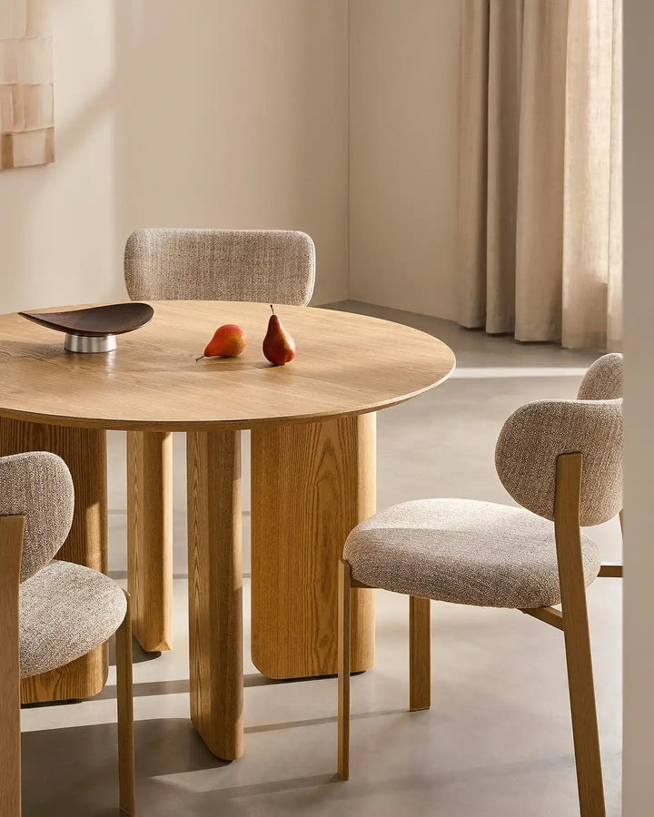 Bramley wooden dining table with three matching dining chairs, showcasing the thick tabletop and solid oak-effect legs