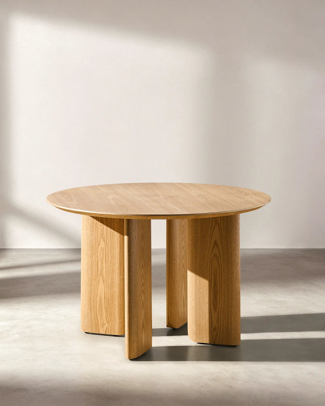 Bramley dining table side view showcasing the clean farmhouse-inspired silhouette