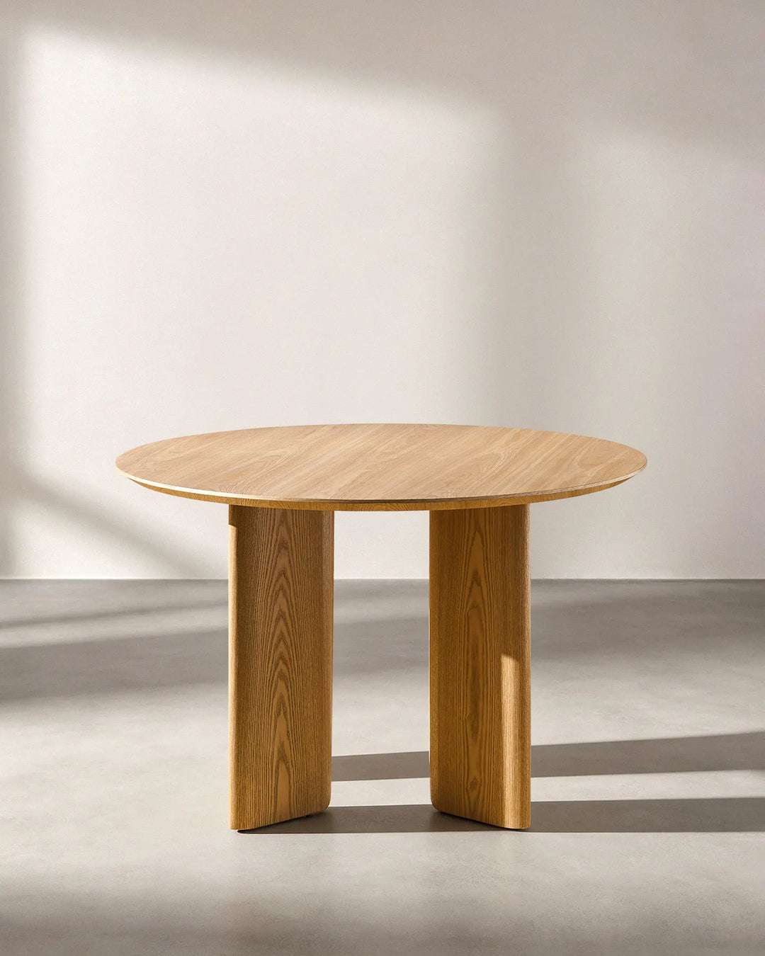 Bramley oak dining table angled view displaying the tabletop proportions and leg design