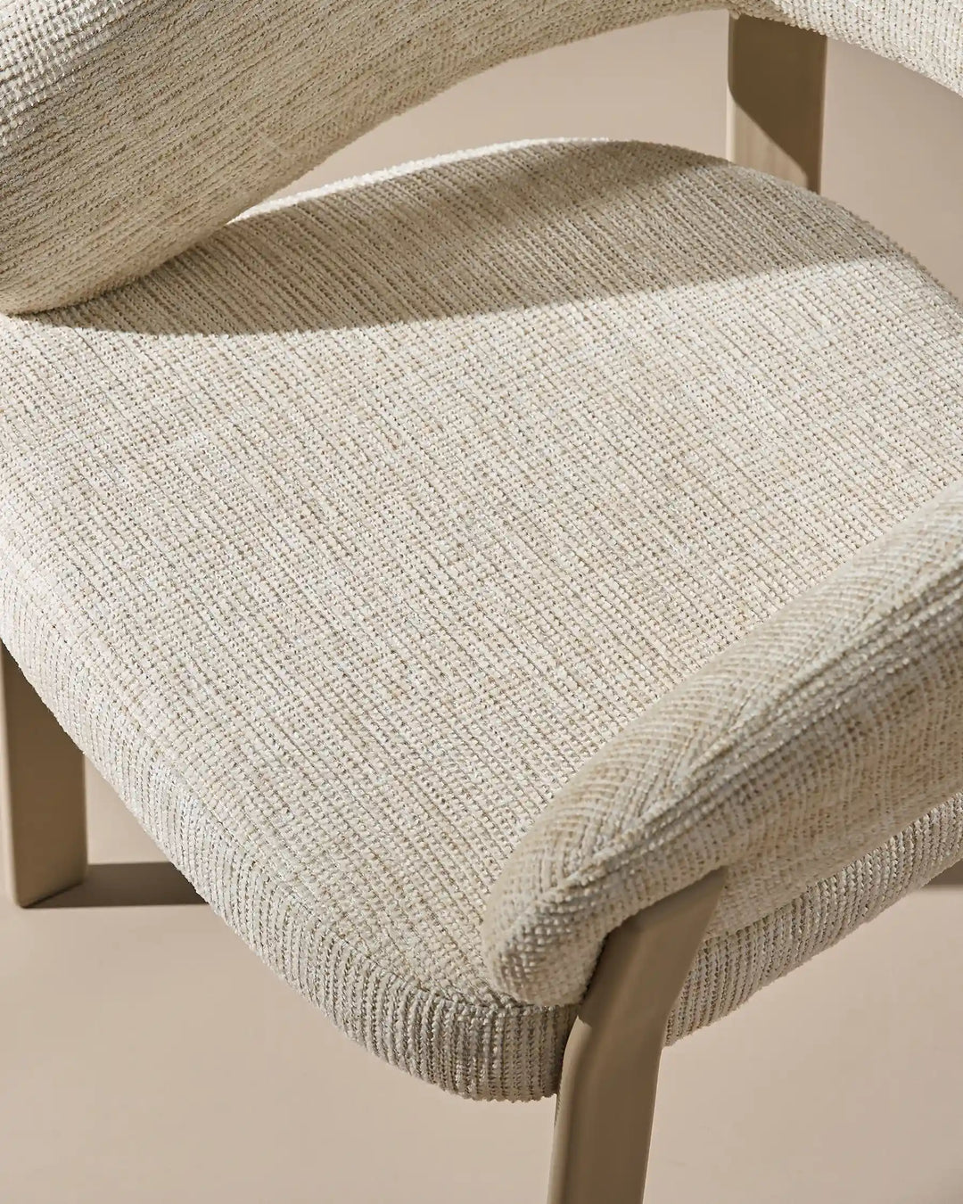Top view of Bramley ivory and off white upholstered dining armchair with soft textured chenille seat
