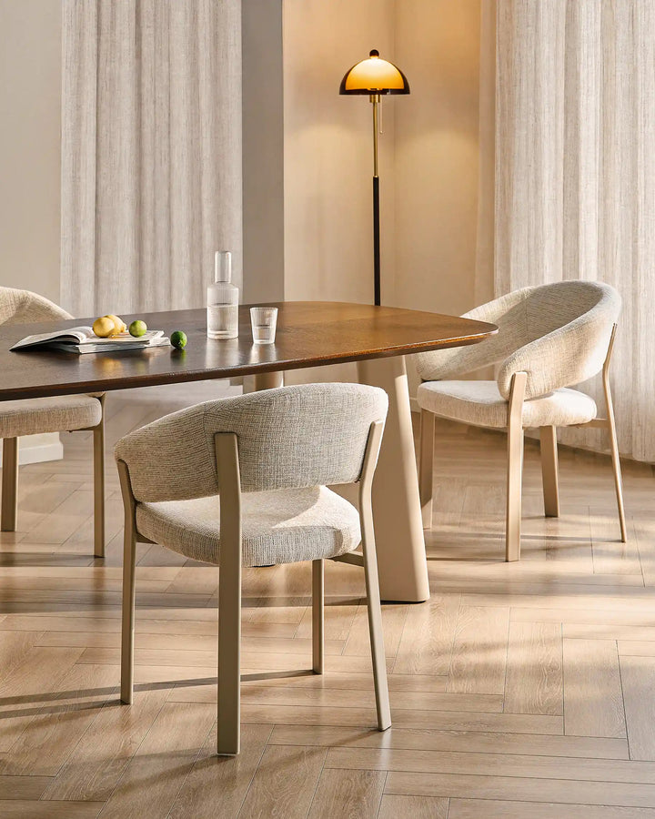 Two Bramley ivory and off white dining armchairs placed at a dining table in an organic farmhouse dining room