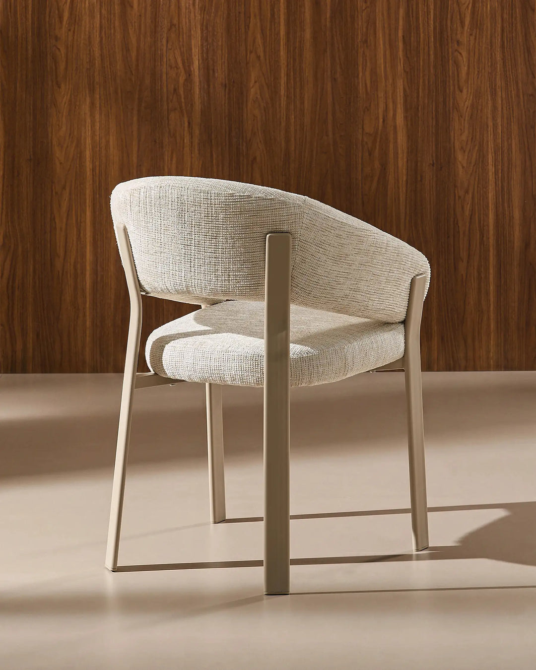 Rear view of Bramley ivory and off white upholstered dining armchair displaying the backrest design