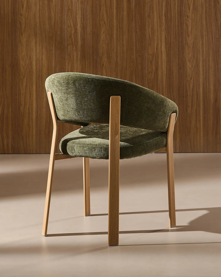 Rear view of Bramley moss green and oak upholstered dining armchair displaying the backrest design