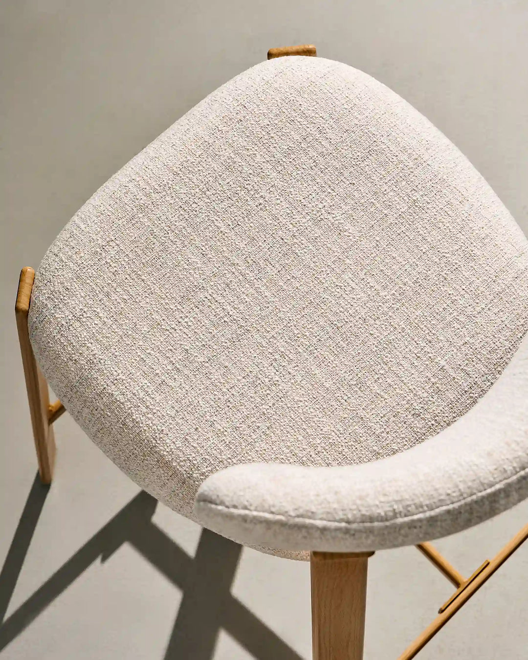 Top view of Bramley Oak Bar Stool highlighting spacious upholstered seat and linen fabric texture