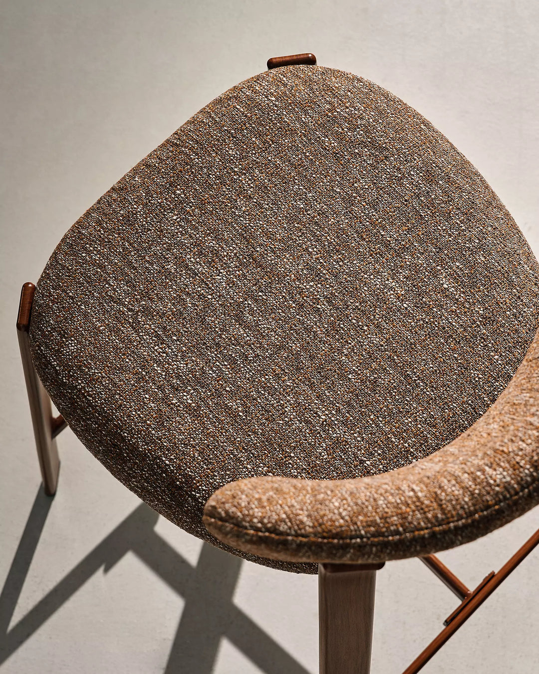 Top view of Bramley Walnut Bar Stool highlighting spacious upholstered seat and linen texture