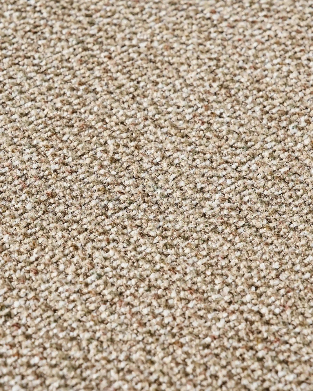 Close-up of warm taupe chenille upholstery showing the fabric texture and natural woven finish