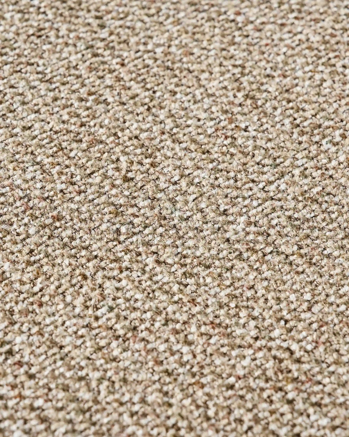 Close-up of warm taupe chenille upholstery showing the fabric texture and natural woven finish