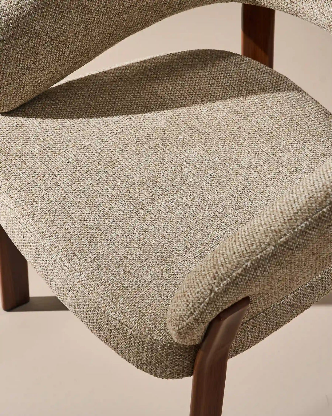 Top view of Bramley warm taupe and walnut upholstered dining armchair with soft textured chenille seat