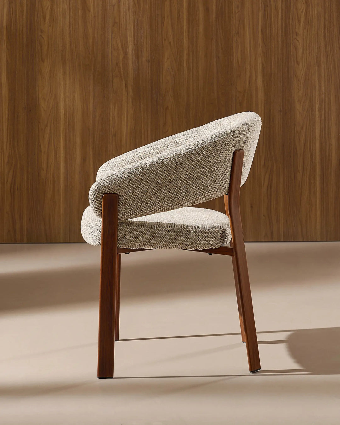 Rear view of Bramley warm taupe and walnut upholstered dining armchair displaying the backrest design