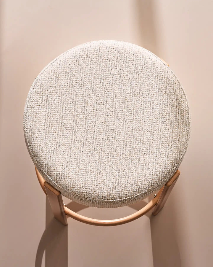 Top view of the Bramley cream chenille backless bar stool, showing its rounded padded seat and textured upholstery