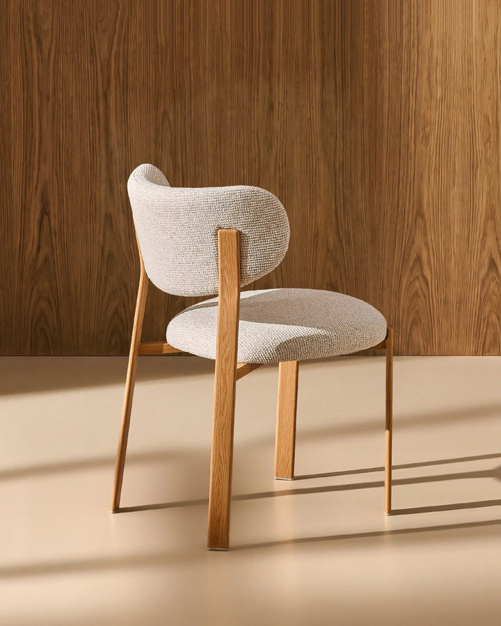 Rear view of the Bramley cream chenille dining chair, highlighting the curved backrest and natural wood-effect legs