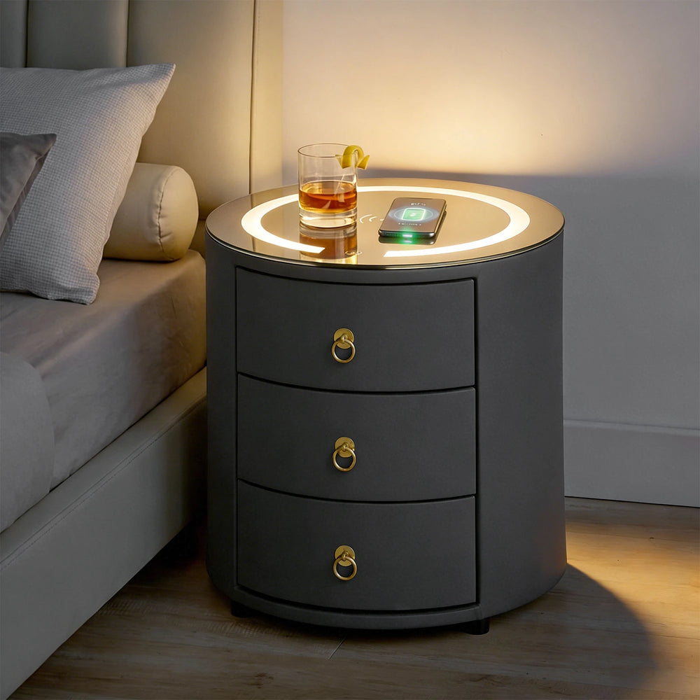 Brookline bedside table at night with LED light on and phone charging wirelessly.